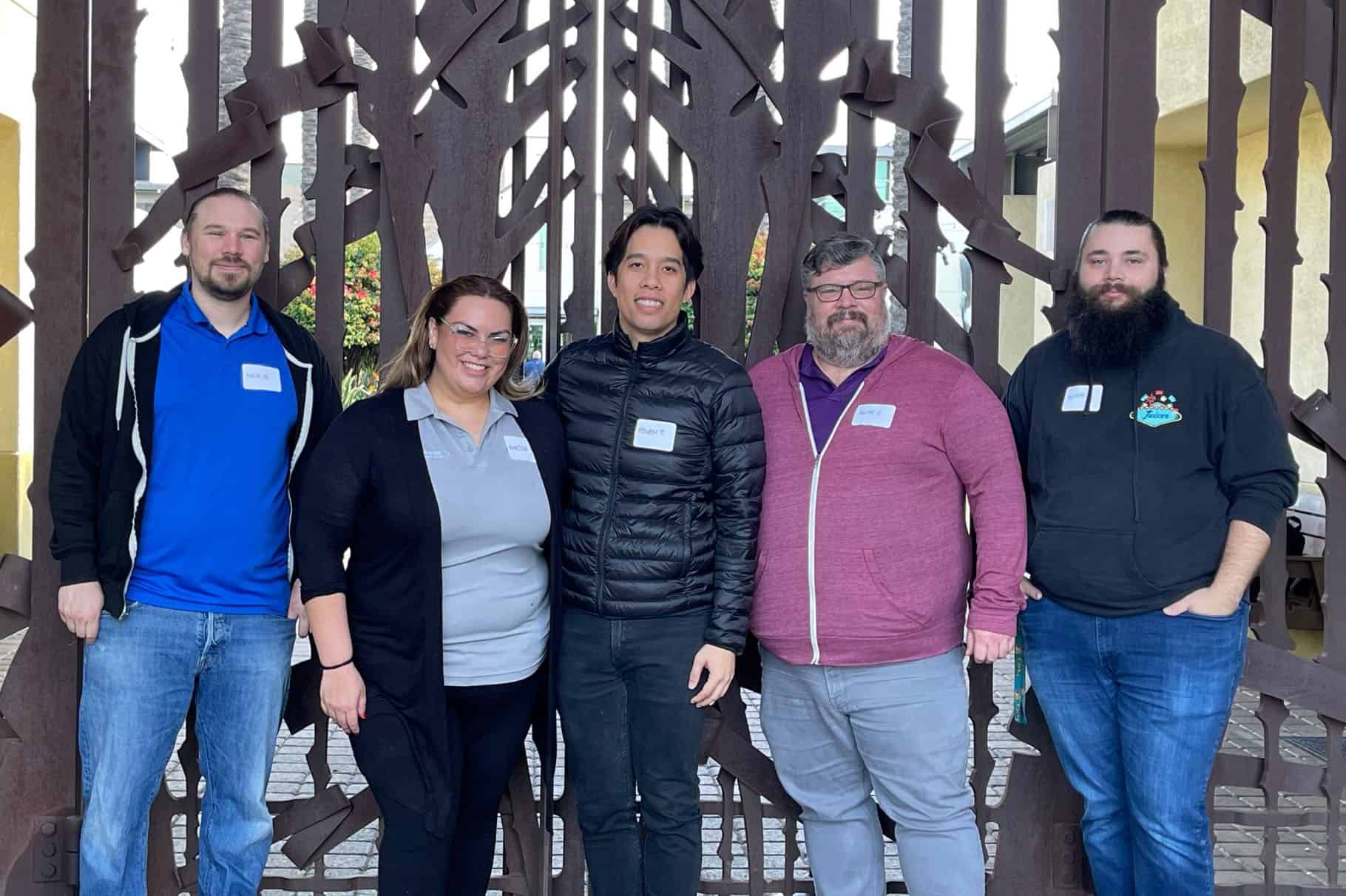 Group of people standing in front of gate