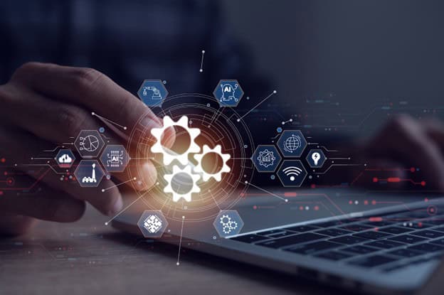 Business Process Automation shown through hand tapping in front of laptop