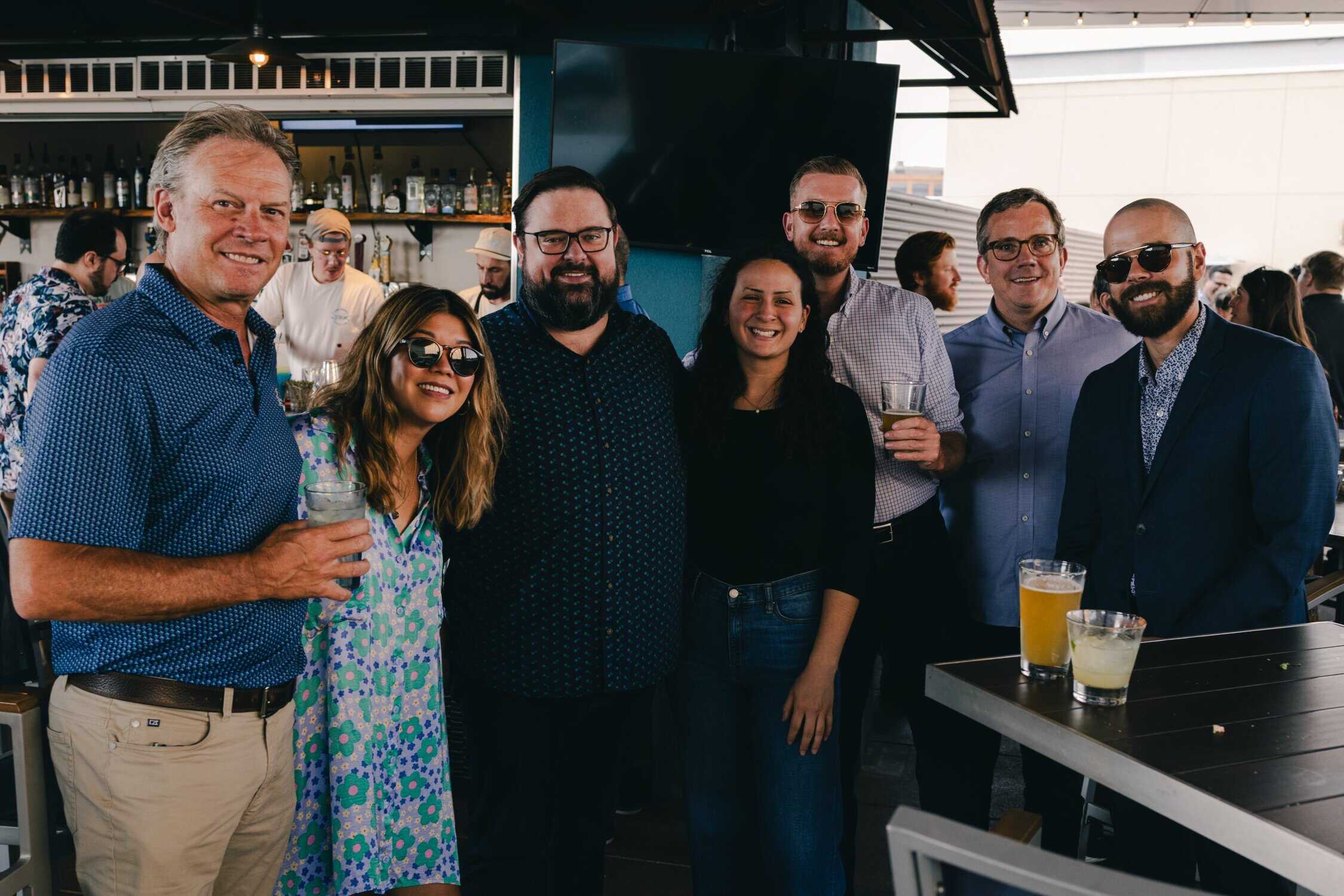A group of people together for the Denver Client Appreciation Event at the rooftop bar